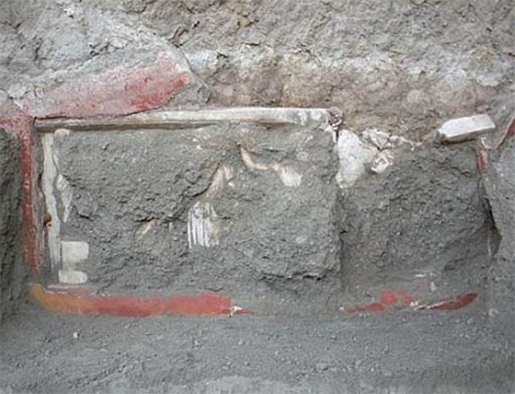 House of Dionysiac Reliefs, Herculaneum. February 2009. Room (m). The second marble relief is shown attached to the wall at the time of discovery.